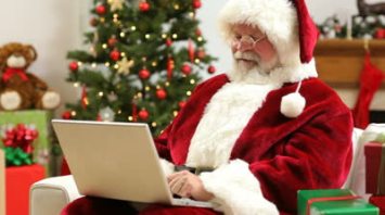 stock-footage-santa-claus-sitting-with-laptop-computer