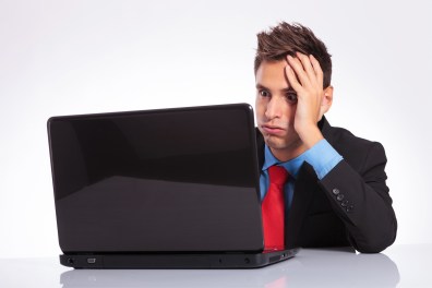 bigstock-young-business-man-sitting-at-42571705